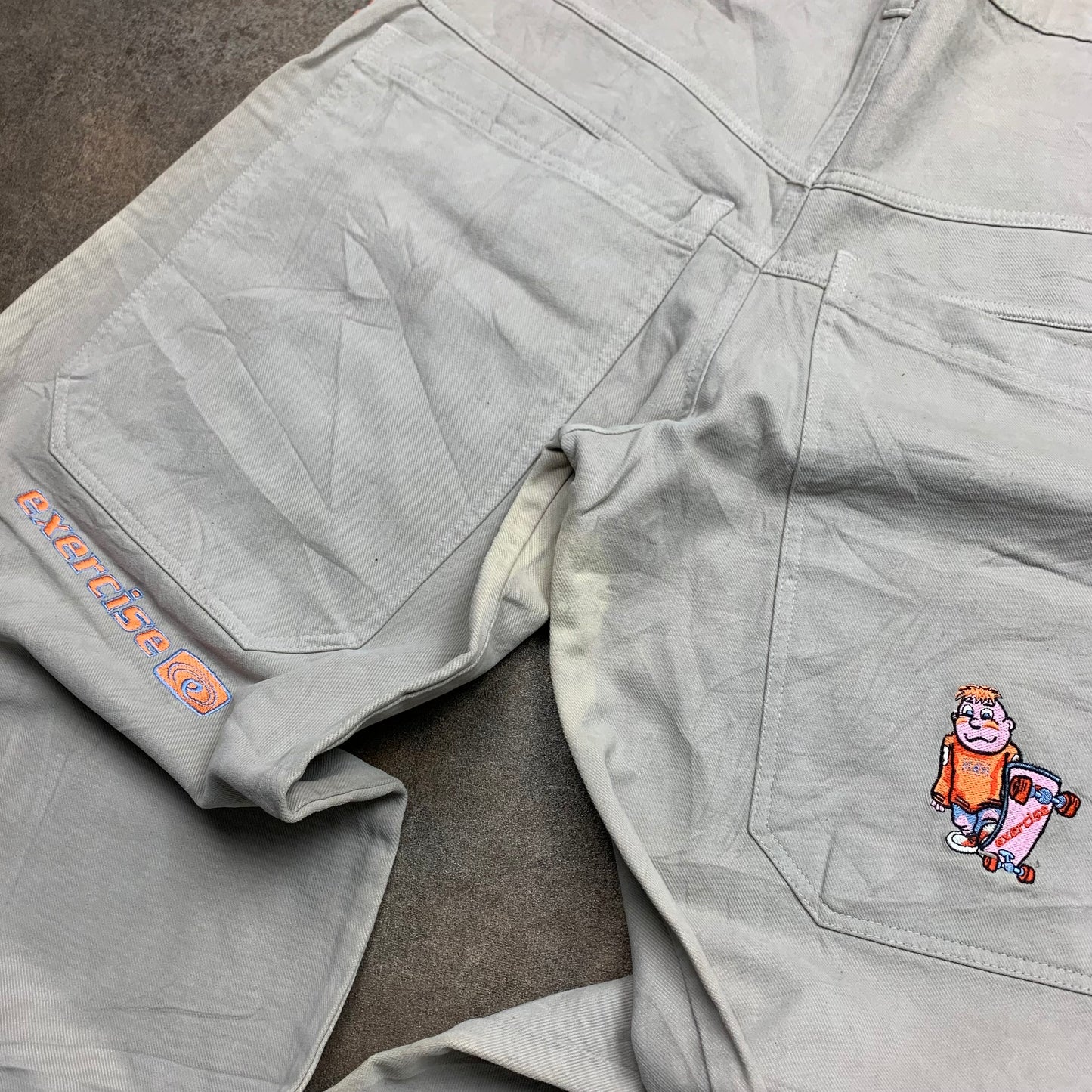 Exercise Surfwear 90s cream baggy graphic jeans