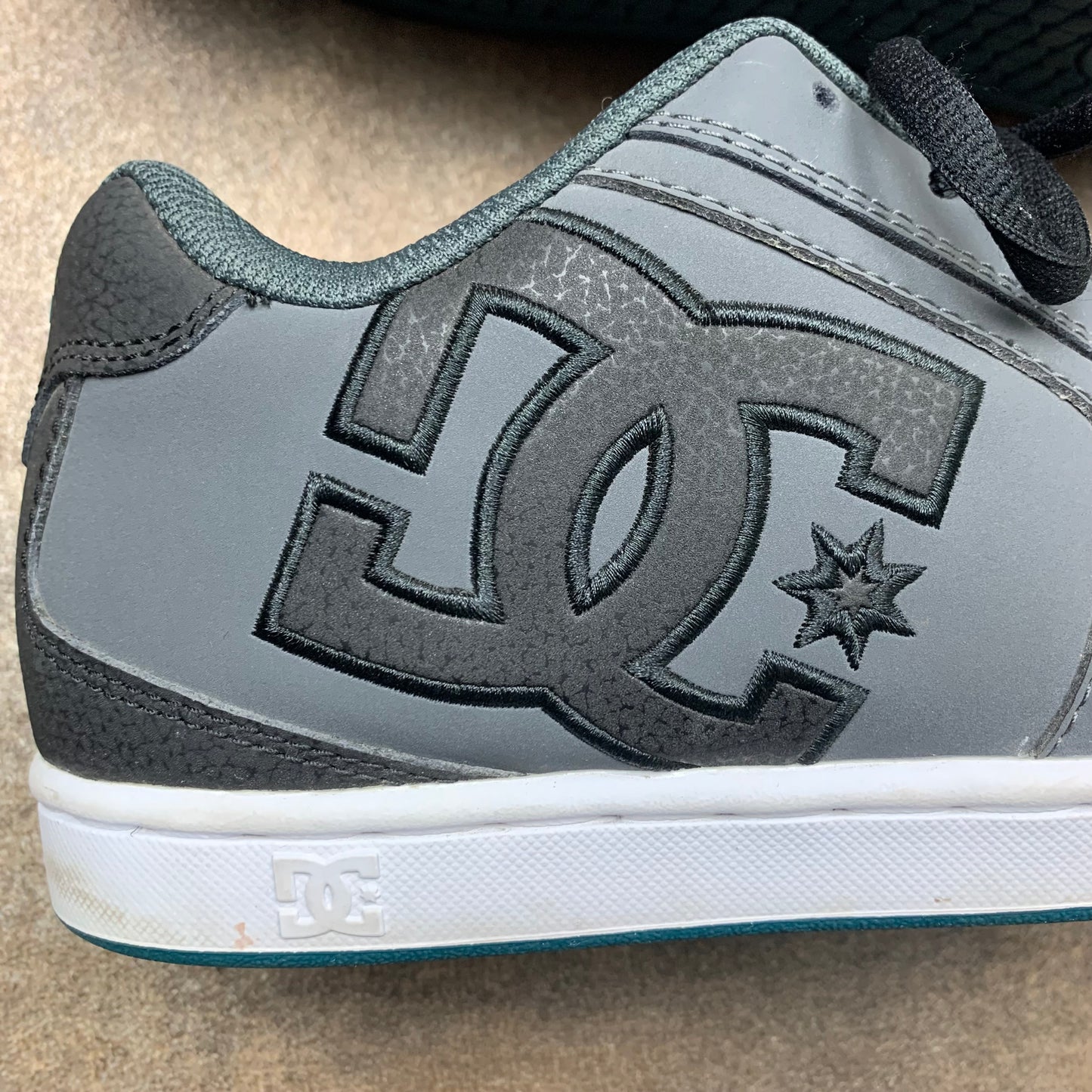 DC Shoes grey grunge studded trainers