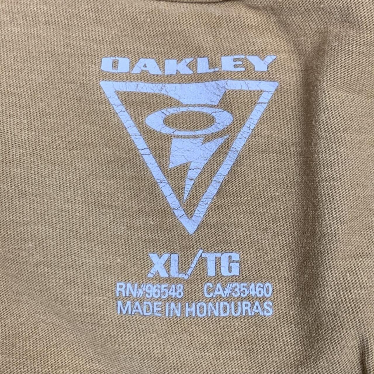 Oakley Elite 00s mustard yellow graphic tee
