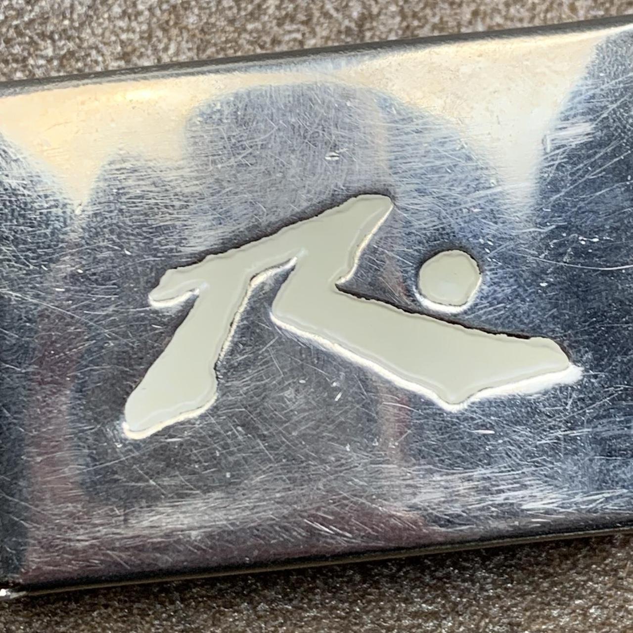 Rusty 00s graphic belt buckle