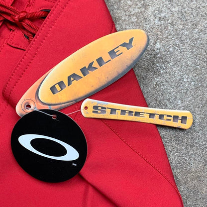 Oakley Software 00s red graphic baggy boardshorts